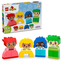 LEGO Duplo figurines with colorful hair colors and a matching box on a white background